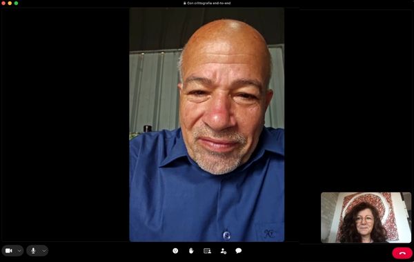 A video call with two participants, shown in a main window and a smaller inset.